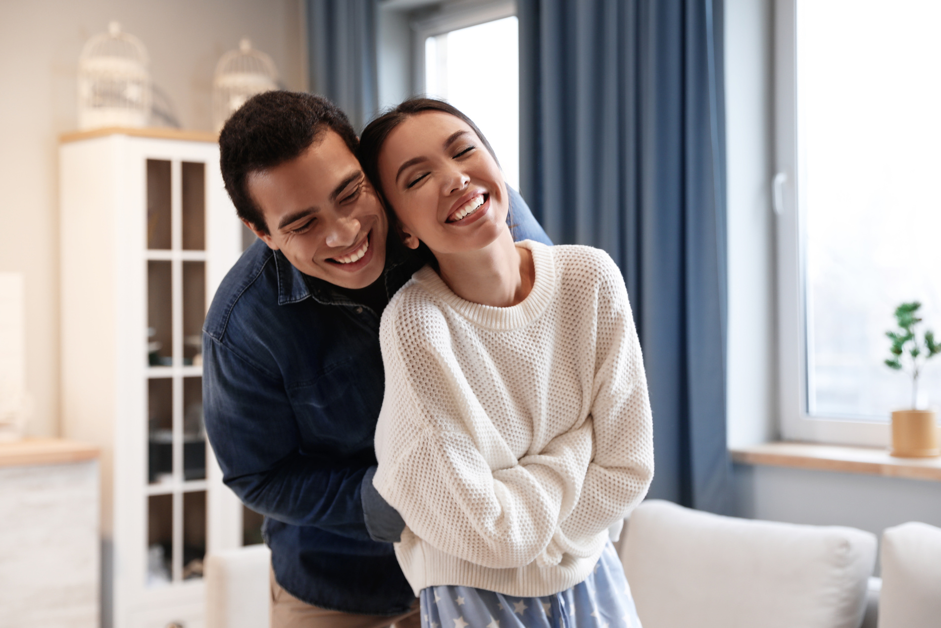 Lovely Young Interracial Couple Dancing at Home